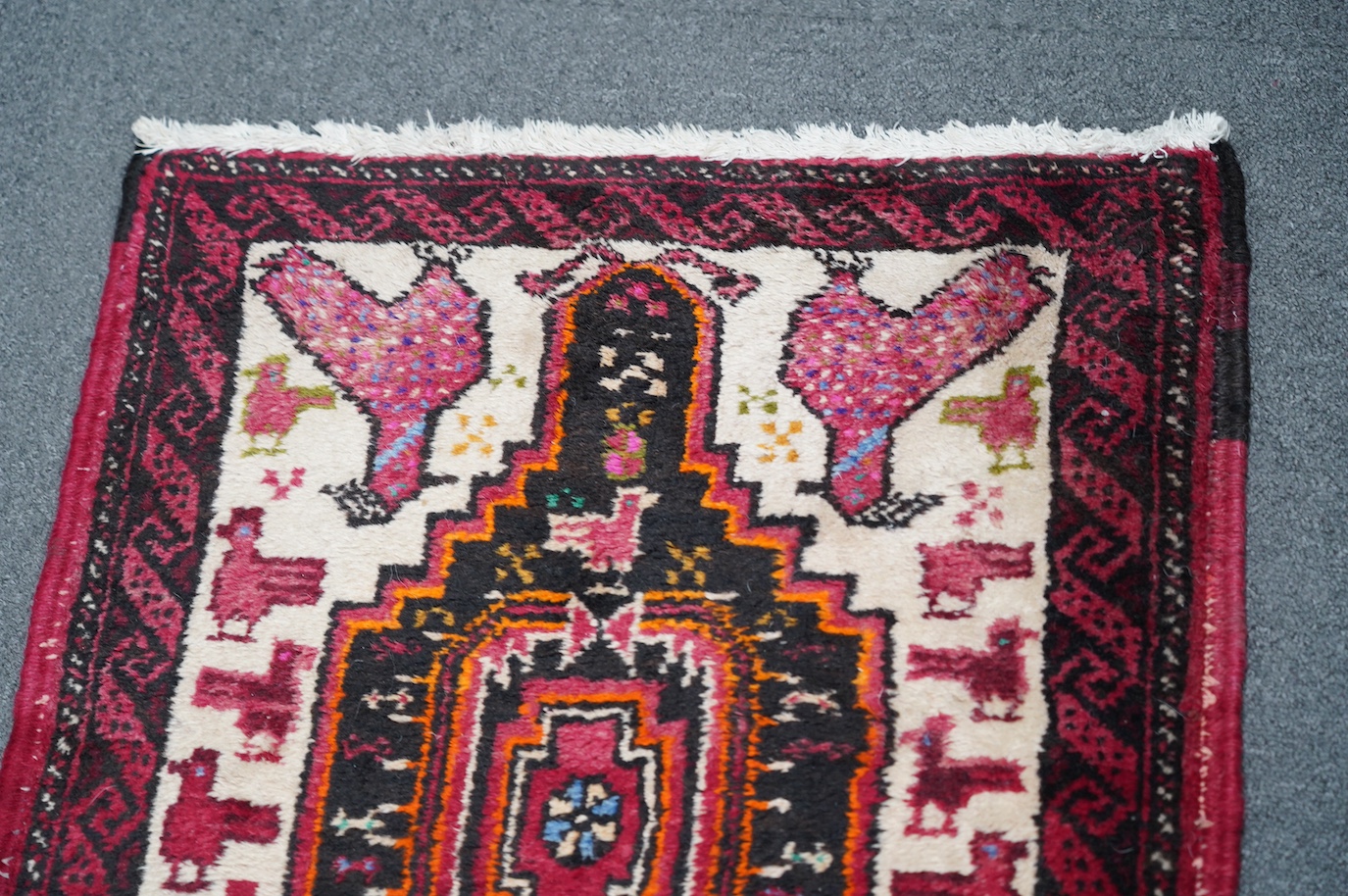 A Turkish red ground geometric runner, 266 x 63cm. Condition - good